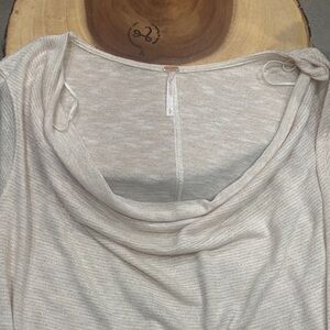 3/4 sleeve w/a draped collar. The material is a game changer and elegant.